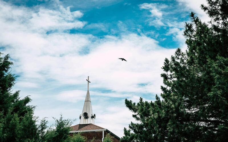 How Communities Preserve Identity Under Pressure